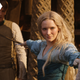 Galadriel holds two men at sword point.